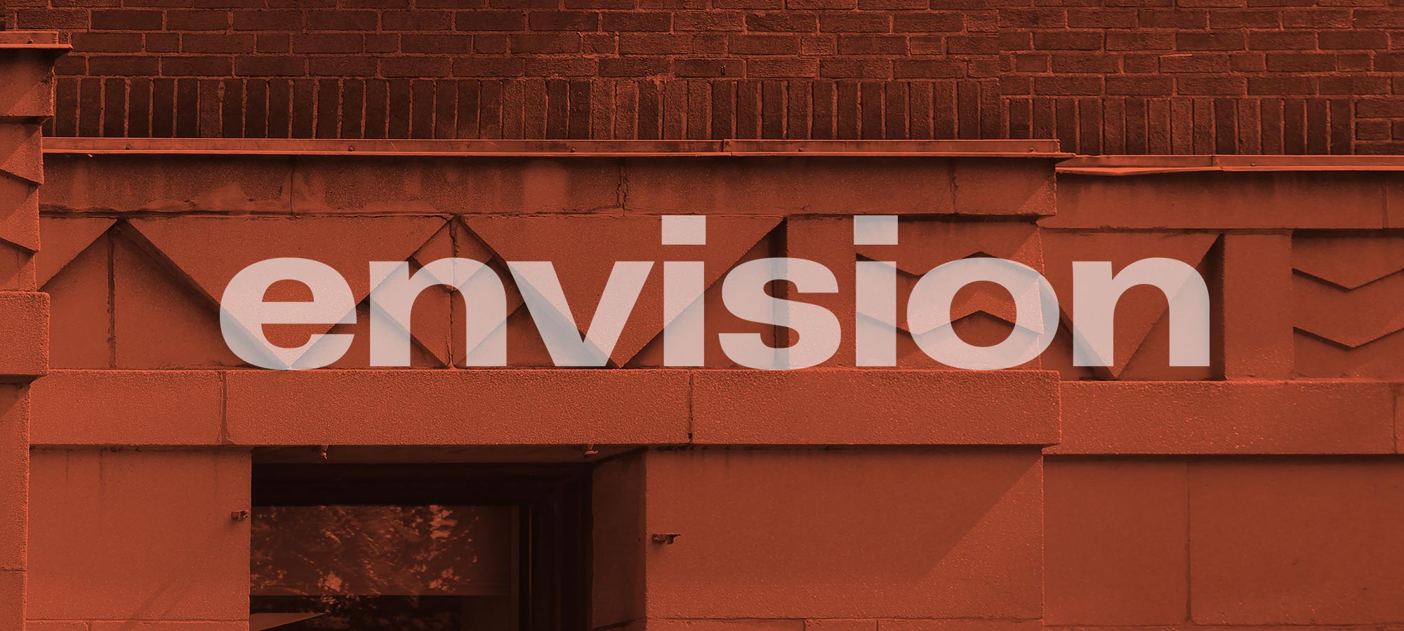 Text that reads ‘envision’ on orange-tinted photo of Art Deco building detail.